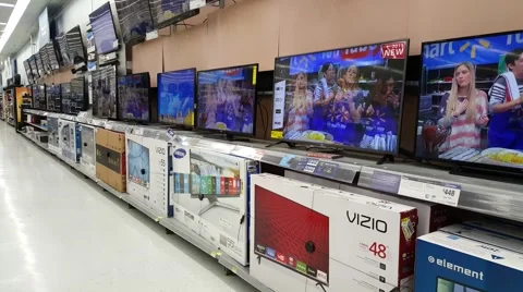 Smart TVs on display at Walmart supermarket store Stock Footage