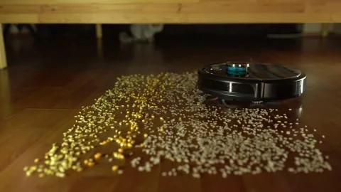 The smart vacuum cleaner cleans the dirt on the floor. Stock Footage 181196973