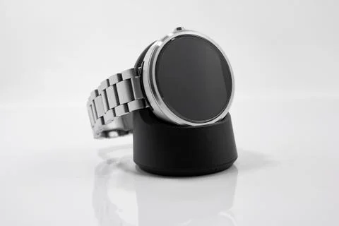 Smart Watch on Charging Base Stock Photos