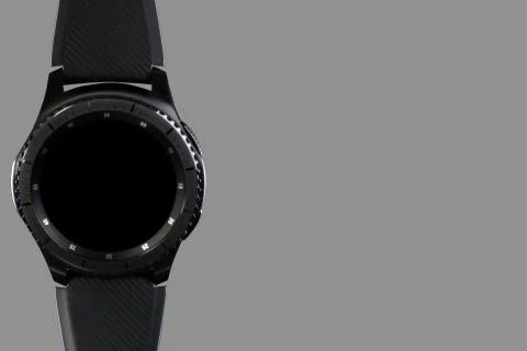 Smart watch with an empty dial on a grey background Stock Photos