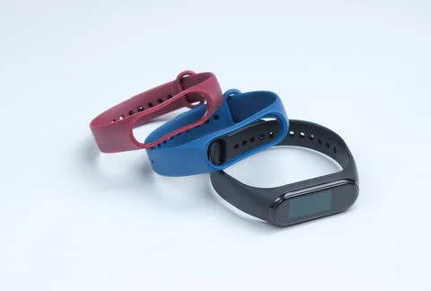 Smart watch with interchangeable bracelets on white background. Fitness track Фото