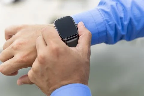 Smart watch on the man's hand. Technology and electronics Stock Photos
