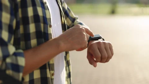 Smart watch. Smart watch on a man's hand outdoor. Man's hand touching a smart Stock Footage 194604542