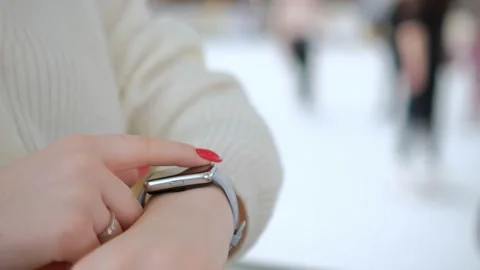 Smart watch. Smart watch on a woman's hand indoor. Woman's hand touching a smart Stock Footage 230944041