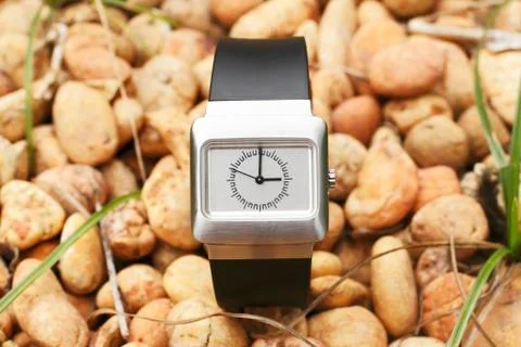 Smart watch on stone Stock Photos