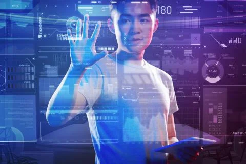 Smart web developer standing with a tablet and working with a futuristic device Stock Photos