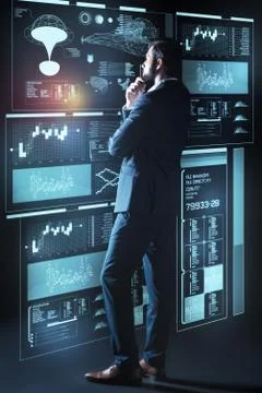 Smart web developer touching his chin while standing thoughtfully 스톡 사진
