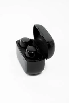 Smart Wireless Earbuds with Voice Assistant on White Background Foto stock