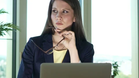 Smart Woman Thinking Brainstorming on Computer Desk in Modern Office Stock-Footage 98554270