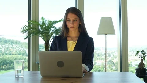 Smart Woman Thinking Brainstorming on Computer Desk in Modern Office Stock-Footage 98554695
