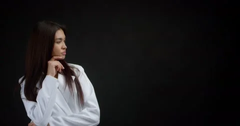 Smart woman thinks about something and gives a thumbs up Stock Footage 170367945