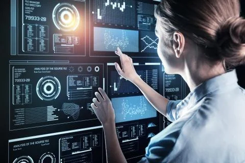 Smart woman touching the screen while working on her computer Stock Photos