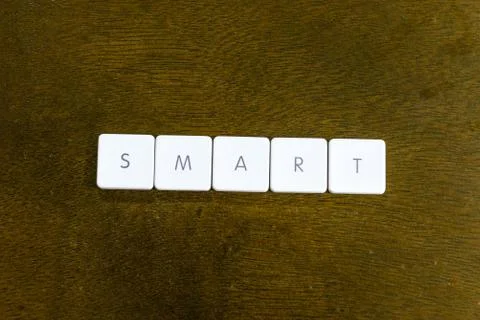 SMART word written on plastic keyboard alphabet with dark background Stock Photos