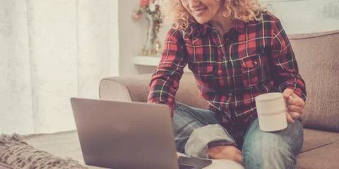 Smart work home activity wiith modern online computer laptop technology and c Stock Photos