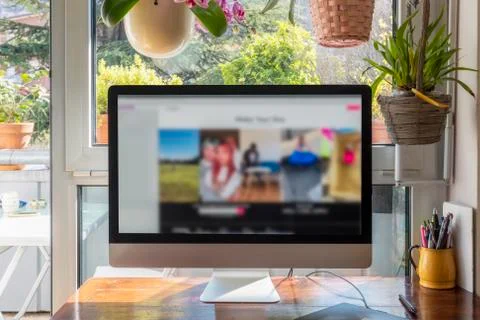 Smart work, pc at home in front of a window Stock Photos
