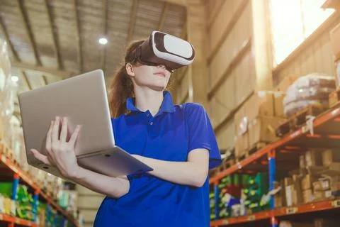 Smart worker using modern advance technology digital VR device to control o.. Stock Photos
