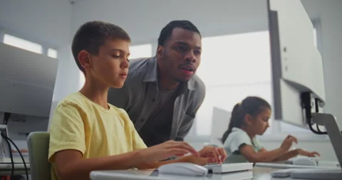 Smart Young Boy Using Computer, Doing 3D Design Project. Teacher Helping Stock Footage 316298185