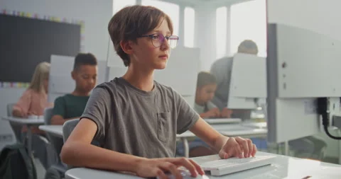 Smart Young Boy Using Computer, Learning Coding During Digital Programming Stock Footage 316303440