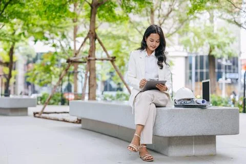 Smart young engineer using tablet sketch design at green park nature. Envir.. 스톡 사진