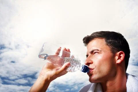 Smart young guy drinking water - Copyspace. Closeup of a smart young guy Foto stock