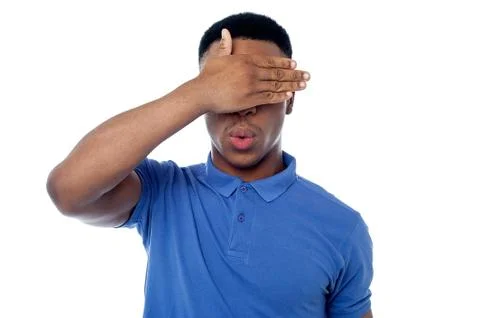 Smart young guy hiding his eye Stock Photos