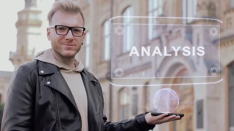 Smart young man with glasses shows a conceptual hologram Analysis Video stock 99136471