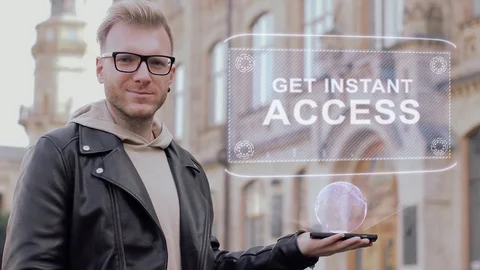Smart young man with glasses shows a conceptual hologram Get instant access Stock-Footage 99734985