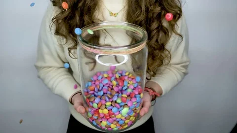 Smarties dropping in big Glas Video stock 81167140