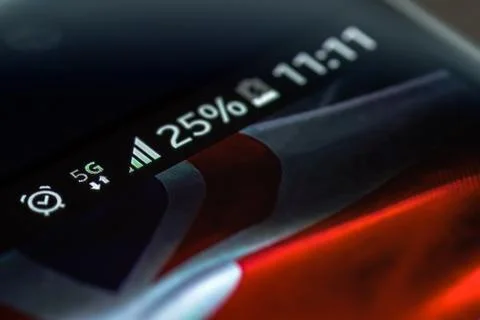 Smartphone 5G network 25 per cent charge and UK flag Photos