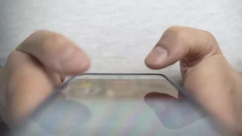 Smartphone addiction concept. Hands scrolling through social network app Stock Footage 274500602
