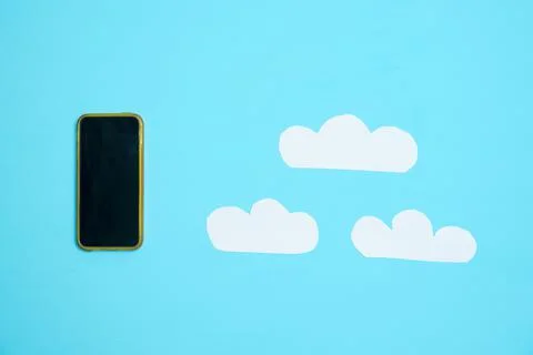 Smartphone and clouds Stock Photos