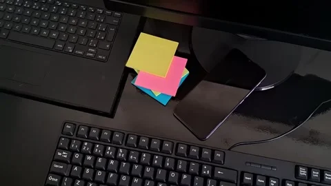 Smartphone and colorful sticky notes on a dark office desk animation Stock Footage 340038083