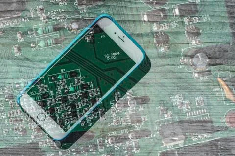 Smartphone and computer board Stock Photos