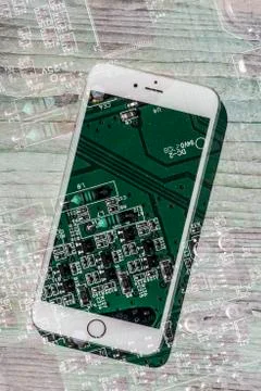 Smartphone and computer board Stock Photos