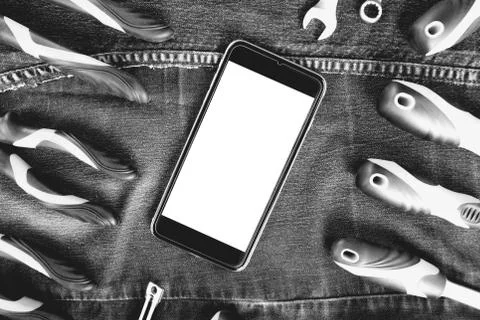 Smartphone and construction tools with blank for sign, top view, flat lay. .. Stockfoto's