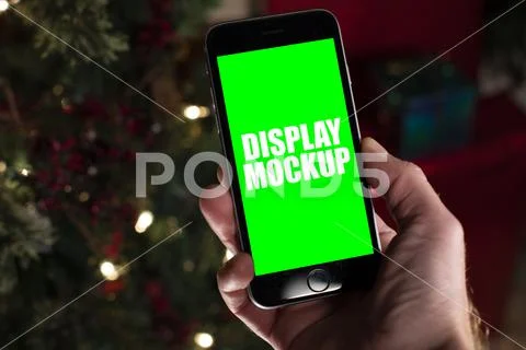 Smartphone and hand at Christmas template PSD Template