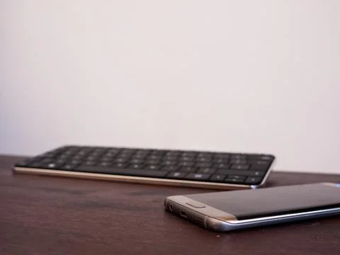 Smartphone and Keyboard Stock Photos