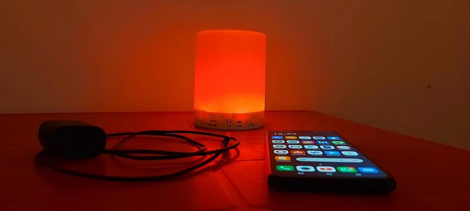 Smartphone and a lamp for tech articles (3) Stock Photos