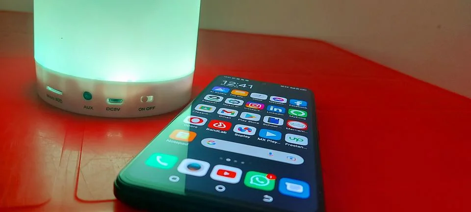 Smartphone and a lamp for tech articles (2) Stock Photos