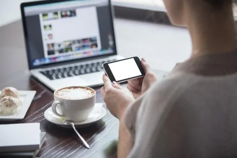 Smartphone and laptop data synchronization. Close-up 스톡 사진