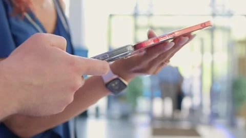 Smartphone and tablet data synchronization, businesswoman syncing files and Video stock 311488664
