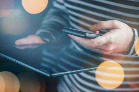 Smartphone and tablet data synchronization, woman transfering fi Stock Photos
