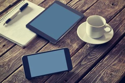 Smartphone and tablet on table Stock Photos