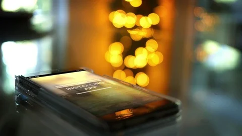 A Smartphone with an app installation screen with cinematic bokeh Stock Footage 81021995