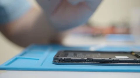 Smartphone assembling in repair shop Stock Footage 113675428
