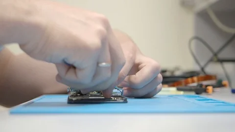 Smartphone assembling in repair shop Stock Footage 113675466