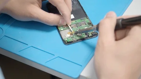 Smartphone assembling in repair shop 動画素材 113675486