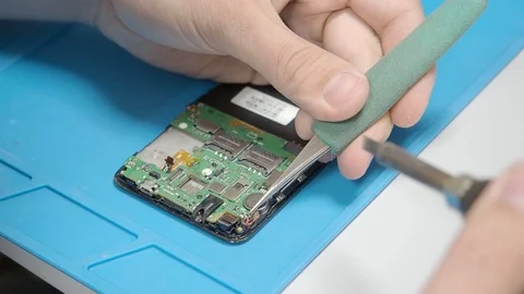 Smartphone assembling in repair shop Stock Footage 113675495