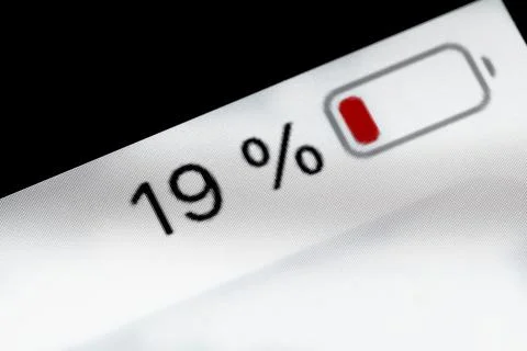 Smartphone battery level indicator - nineteen, 19 percent: close up macro Stock Photos