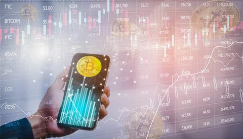 Smartphone with Bitcoin chart on-screen among piles of Bitcoin concept. busin Stock Photos